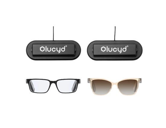 The Couples Pack by Lucyd Bundles includes two smart glasses—one black rectangular and one beige cat-eye—shown with two black charging devices and cords, making it an ideal set for couples.