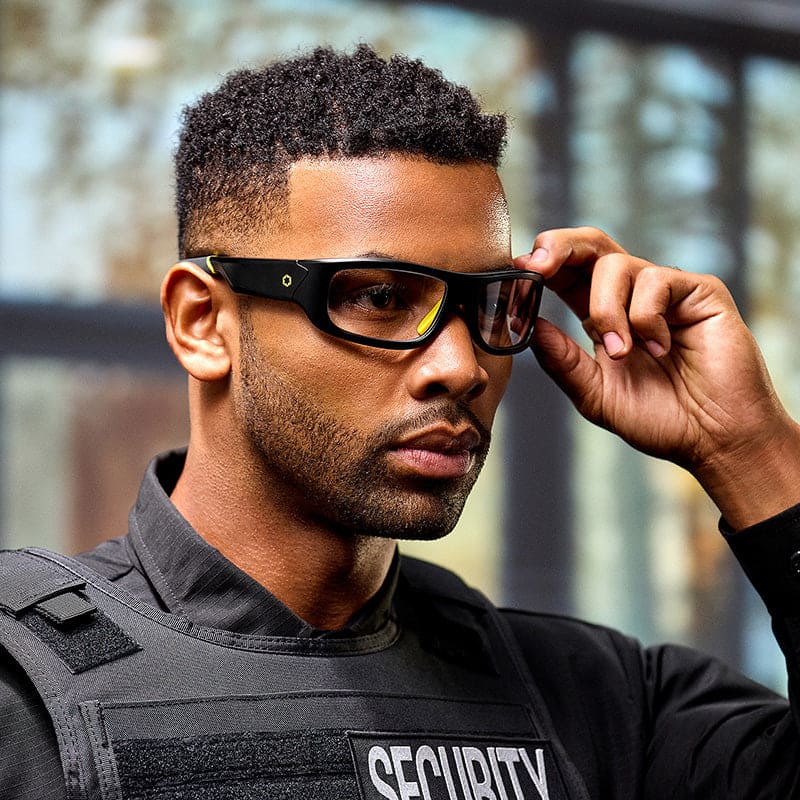 Security professional adjusting Lucyd Armor Photochromic smart glasses