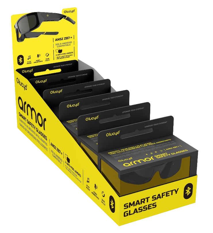 A Lucyd Bundles Armor 6-pack display box contains multiple pairs of Lucyd Armor safety smart glasses in black and yellow packaging, featuring Bluetooth connectivity, ANSI Z87.1 certification, and photochromic lenses for workplace safety.