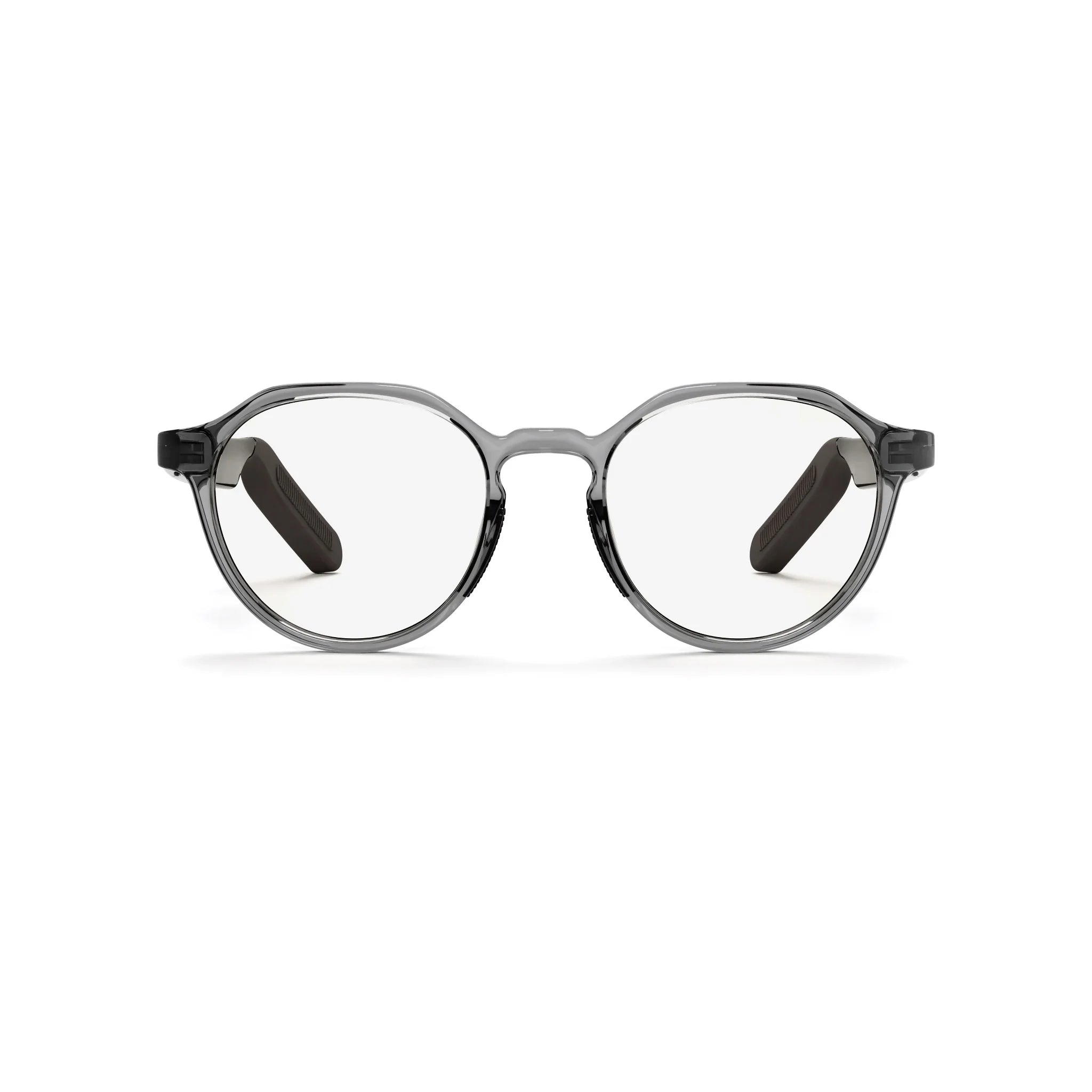 The Reebok Jet features round clear lenses and transparent gray frames with black temples, giving these premium smart glasses a modern look. The glasses are displayed on a plain white background.