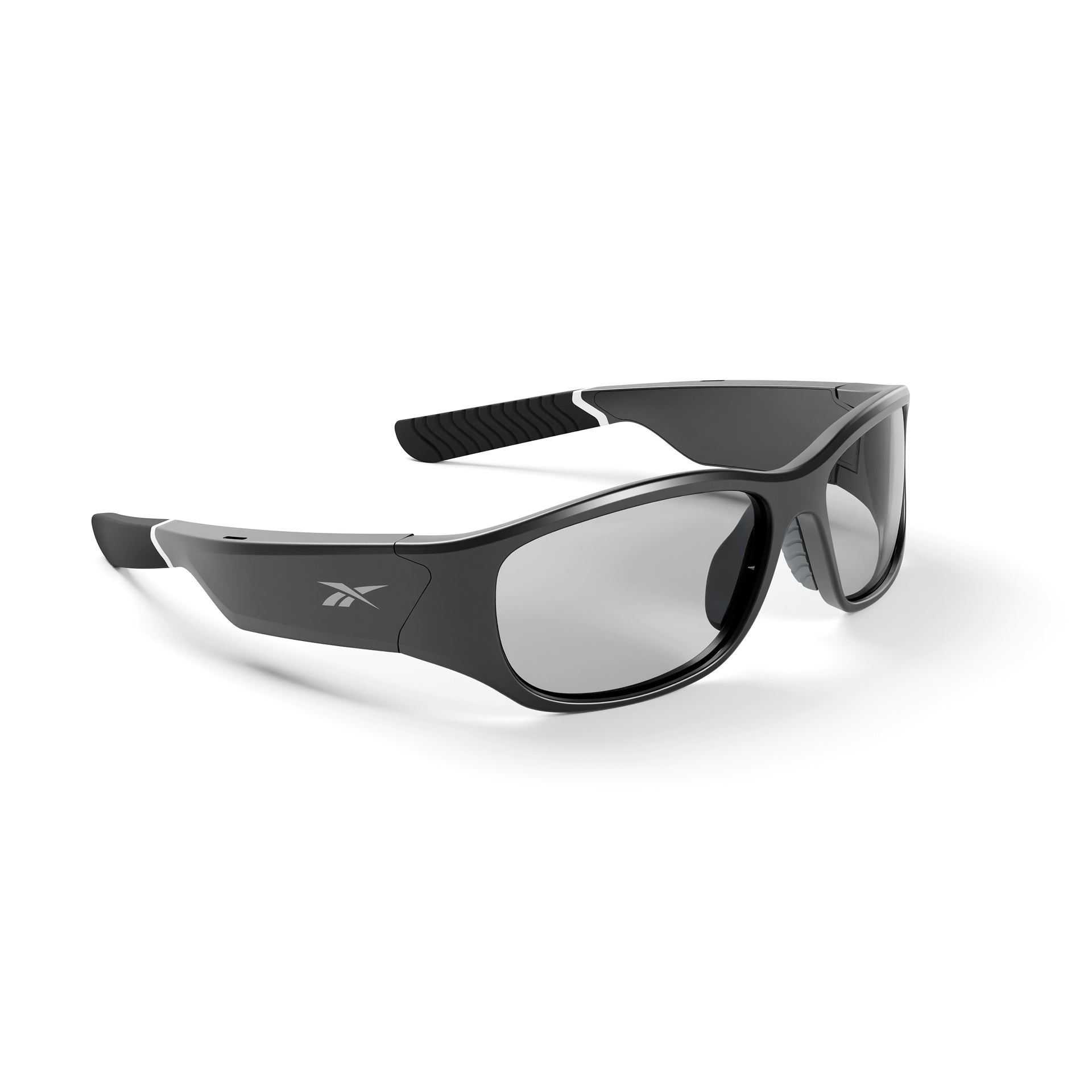 The Reebok Nitrous Shift is a pair of sleek black smart sports sunglasses with adaptive photochromic lenses and a small white logo on the temples, shown against a white background.