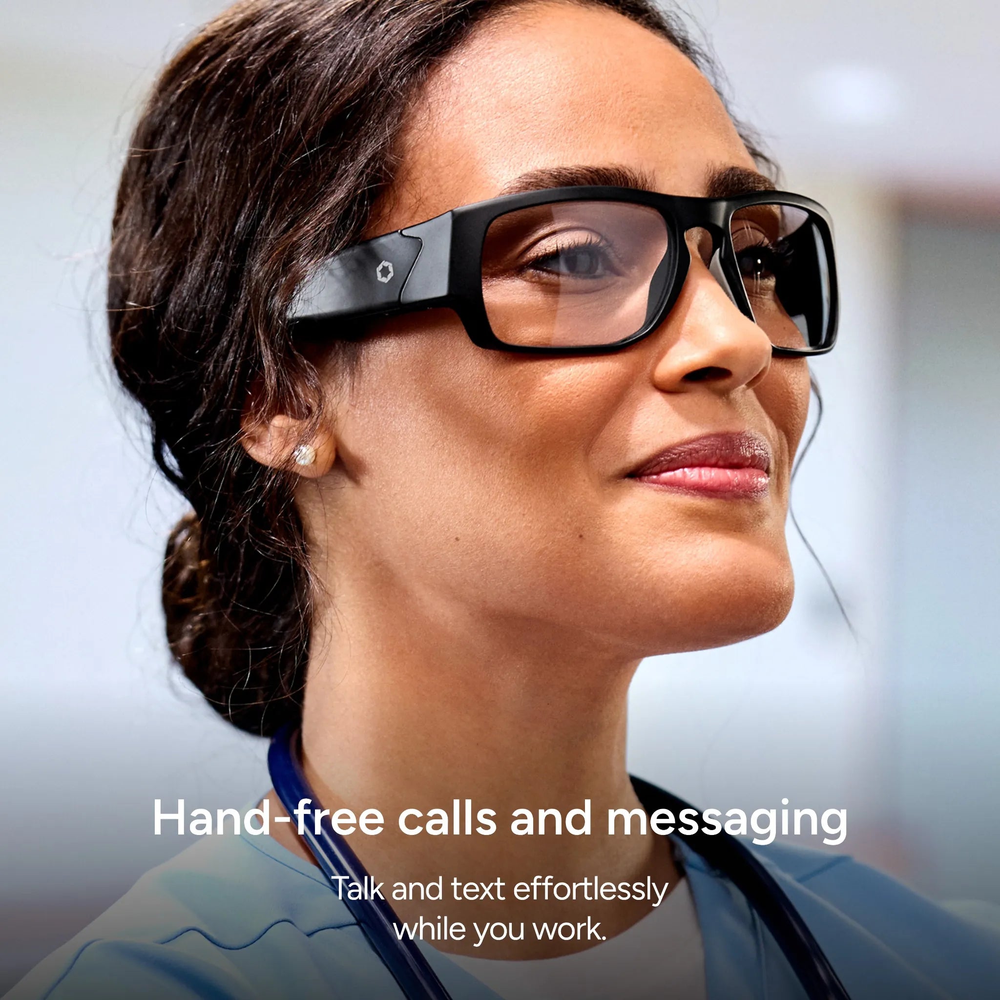 A woman smiles, wearing Lucyd Armor | Vantage Photochromic smart glasses. Text: Hands-free calls & messaging. Talk and text easily while you work with prescription-ready Lucyd eyewear.