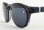 Close-up of LUCYD EYEWEAR Chemistrie® Clip-on Lenses—dark, round sunglasses with thick black frames and reflective lenses, featuring a custom magnetic eyeglass clip, shown against a white background.